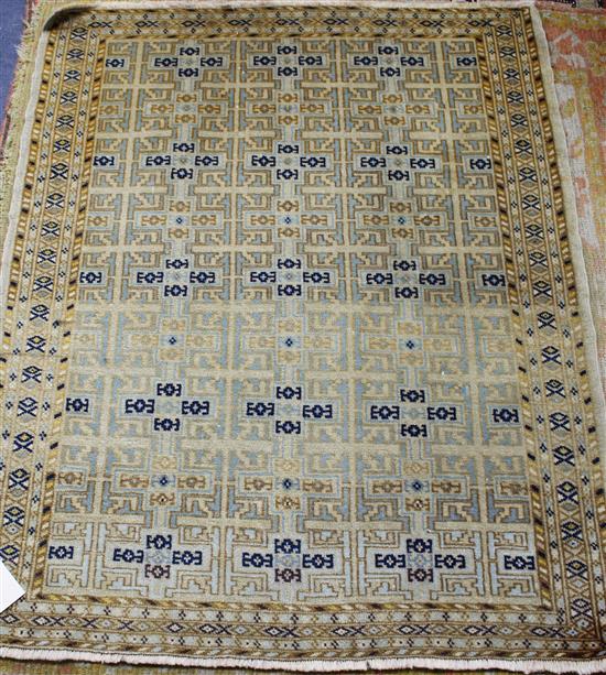 An Anatolian cream ground rug, with dense field of geometric motifs, 112 x 89cm